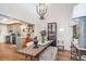 Spacious dining room with an open layout, hardwood floors, and adjacent kitchen at 666 Serramonte Dr, Marietta, GA 30068