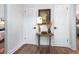 Hallway with hardwood floors, a vintage table, and unique decor at 666 Serramonte Drive Dr, Marietta, GA 30068