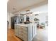 Bright kitchen with marble island, stainless steel appliances, and hardwood floors at 666 Serramonte Drive Dr, Marietta, GA 30068