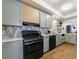 Stylish kitchen features modern appliances and sleek cabinets at 666 Serramonte Drive Dr, Marietta, GA 30068
