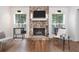 Inviting living room with stone fireplace and hardwood floors at 666 Serramonte Drive Dr, Marietta, GA 30068