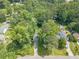 An aerial view of a leafy neighborhood with tree-lined streets and manicured lawns showcasing the home's setting at 2863 Jordan Forest Trl, Lawrenceville, GA 30044