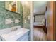 Bathroom featuring a sink, mirror, and doorway into bedroom at 2863 Jordan Forest Trl, Lawrenceville, GA 30044