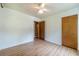 Bedroom featuring a ceiling fan, wood-look floors, and neutral decor at 2863 Jordan Forest Trl, Lawrenceville, GA 30044