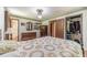 Bright bedroom features a ceiling fan, wood floors, and ample closet space at 2863 Jordan Forest Trl, Lawrenceville, GA 30044