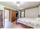 Bedroom with wood floors, neutral walls, and closet at 2863 Jordan Forest Trl, Lawrenceville, GA 30044