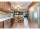 Eat-in kitchen features stainless steel appliances, wood cabinets, and mosaic backsplash at 2863 Jordan Forest Trl, Lawrenceville, GA 30044