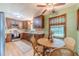 Eat-in kitchen featuring wooden cabinets, stainless steel appliances, and a breakfast nook at 2863 Jordan Forest Trl, Lawrenceville, GA 30044