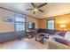 Living room featuring a ceiling fan, wood-look floors, and neutral decor at 2863 Jordan Forest Trl, Lawrenceville, GA 30044
