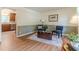 Sitting room featuring hardwood floors, decorative rug, and natural light at 2863 Jordan Forest Trl, Lawrenceville, GA 30044