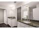 Bathroom features a granite countertop vanity, and framed mirror at 325 Nutwood Trce, Locust Grove, GA 30248