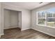 This living room boasts lots of natural light and hardwood floors, creating an inviting space at 325 Nutwood Trce, Locust Grove, GA 30248
