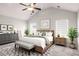 Spacious main bedroom with vaulted ceiling, natural light, and stylish decor at 325 Nutwood Trce, Locust Grove, GA 30248