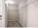 Walk-in closet with carpet, white wire shelving, and neutral walls at 325 Nutwood Trce, Locust Grove, GA 30248