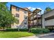 Building exterior showcasing balconies, lush greenery, and architecture at 3777 Peachtree Ne Rd # 1313, Brookhaven, GA 30319