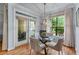 Cozy dining area with modern table and chairs, and access to the balcony at 3777 Peachtree Ne Rd # 1313, Brookhaven, GA 30319
