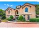 Beautiful building exterior with arched windows, manicured bushes, and elegant architectural details at 3777 Peachtree Ne Rd # 1313, Brookhaven, GA 30319