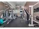 Well-equipped gym featuring various exercise machines, a staircase, and a high ceiling at 3777 Peachtree Ne Rd # 1313, Brookhaven, GA 30319