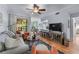 Comfortable living room featuring hardwood floors, a ceiling fan, and stylish furnishings at 3777 Peachtree Ne Rd # 1313, Brookhaven, GA 30319