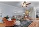 Inviting living room with ample seating, a ceiling fan, and natural light at 3777 Peachtree Ne Rd # 1313, Brookhaven, GA 30319