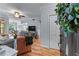 Spacious living room with hardwood floors, comfortable seating, and view of the dining area at 3777 Peachtree Ne Rd # 1313, Brookhaven, GA 30319