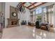Grand lobby featuring a fireplace, high ceilings, ample seating, a chandelier, and large windows at 3777 Peachtree Ne Rd # 1313, Brookhaven, GA 30319