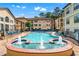 Outdoor swimming pool with lounge chairs and surrounding apartment buildings at 3777 Peachtree Ne Rd # 1313, Brookhaven, GA 30319