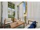 Relaxing screened balcony with comfortable seating, curtains, and outdoor views at 68 Peachtree Memorial Nw Dr # 68-1, Atlanta, GA 30309