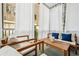 Inviting outdoor screened in balcony with comfortable seating area and curtains at 68 Peachtree Memorial Nw Dr # 68-1, Atlanta, GA 30309