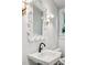 A close up of a sink, toilet, and mirror in an updated bathroom at 68 Peachtree Memorial Nw Dr # 68-1, Atlanta, GA 30309