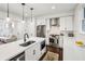 Bright modern kitchen with stainless steel appliances, white cabinetry, and a large island at 68 Peachtree Memorial Nw Dr # 68-1, Atlanta, GA 30309