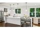 Modern kitchen with stainless steel appliances, white countertops, and stylish pendant lighting at 68 Peachtree Memorial Nw Dr # 68-1, Atlanta, GA 30309