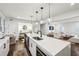 Modern kitchen featuring a large island with a sink and sleek white countertops and cabinets at 68 Peachtree Memorial Nw Dr # 68-1, Atlanta, GA 30309