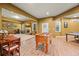 Basement featuring a foosball table, ping pong table, and a fireplace with entertainment center at 8920 Ellesmere Dr, Cumming, GA 30041