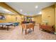 Basement featuring foosball table and a bar with high-top chairs and a television at 8920 Ellesmere Dr, Cumming, GA 30041