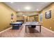 Basement features ping pong table, air hockey table, and foosball table at 8920 Ellesmere Dr, Cumming, GA 30041