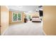 Large main bedroom with tray ceiling, fan, carpet, and plenty of natural light at 8920 Ellesmere Dr, Cumming, GA 30041
