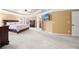 Bright bedroom with tray ceilings, carpet, and natural light at 8920 Ellesmere Dr, Cumming, GA 30041