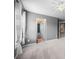 Bedroom with carpet flooring, gray walls, and view of ensuite bath at 8920 Ellesmere Dr, Cumming, GA 30041