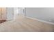 Large bedroom with neutral carpet offering a clean and comfortable living space, perfect for relaxation at 8920 Ellesmere Dr, Cumming, GA 30041