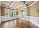 Dining room featuring coffered ceilings and large windows for natural light at 8920 Ellesmere Dr, Cumming, GA 30041