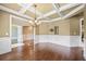 Spacious dining room featuring a coffered ceiling and ample natural light at 8920 Ellesmere Dr, Cumming, GA 30041