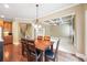 Dining room area features backyard access, stairs to upper level, and easy access to the kitchen at 8920 Ellesmere Dr, Cumming, GA 30041