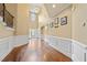 Bright foyer features soaring ceilings and elegant wainscoting for a luxurious feel at 8920 Ellesmere Dr, Cumming, GA 30041