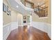 Inviting foyer with hardwood floors and staircase leading to the second level at 8920 Ellesmere Dr, Cumming, GA 30041