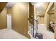 Hallway with carpeted stairs and railing, leading to a finished basement with neutral-toned walls at 8920 Ellesmere Dr, Cumming, GA 30041