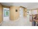 Upstairs hallway with neutral paint, carpet, and natural light at 8920 Ellesmere Dr, Cumming, GA 30041