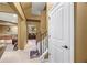 Hallway leading to finished basement with carpeted stairs and a view of the bar and game room at 8920 Ellesmere Dr, Cumming, GA 30041