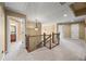Upstairs hallway with carpet and pendant lighting at 8920 Ellesmere Dr, Cumming, GA 30041