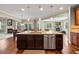Open concept kitchen with a center island, granite countertops, and stainless steel dishwasher at 8920 Ellesmere Dr, Cumming, GA 30041